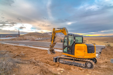 Canvas Print - Excavator in Utah construction area near church