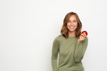 Portrait Of Happy Young Woman With Red Apple