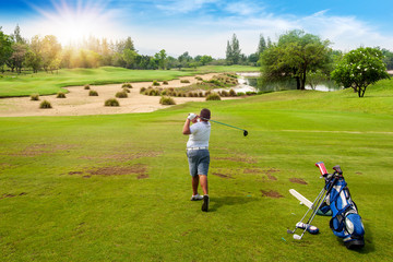 Sticker - 13-year-old Asian boy playing golf on a golf course in the sun - Image