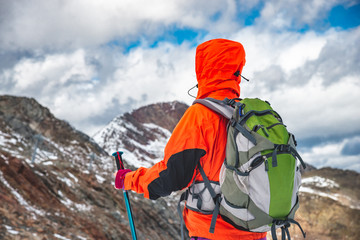 Wall Mural - young woman hiking in the mountains