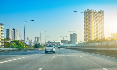 Wall Mural - Car driving  on road and Small passenger car seat on the road used for daily trips