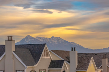 Roof of homes against mountain and sky in Utah