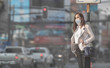 © torwaiphoto - Asian woman are going to work.she wears N95 mask.Prevent PM2.5 dust