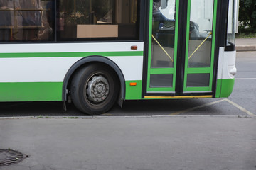  city bus goes along street.