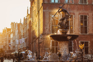 Wall Mural - Poland, Gdansk, Famous Neptune fountain at sunset . Famous travel destination in Europe