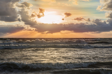 Sticker - sunset in the cloudy sky over the stormy sea