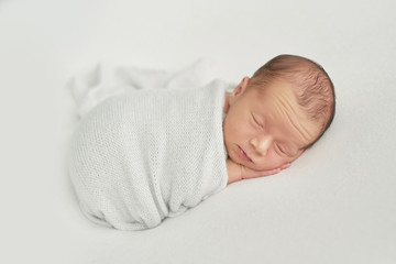 newborn boy on white background