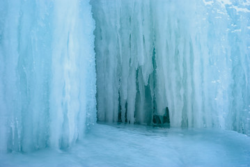 Wall Mural - background - natural ice, section of glacier with icicles, frozen streams of water