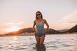 © pha88 - Girl with a gorgeous figure on the sea during sunset.Sexy girl on a wild beach.The girl in the water
