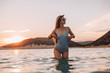 © pha88 - Girl with a gorgeous figure on the sea during sunset.Sexy girl on a wild beach.The girl in the water