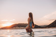 © pha88 - Girl with a gorgeous figure on the sea during sunset.Sexy girl on a wild beach.The girl in the water