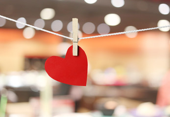 Wall Mural - Red paper hearts hanging on the rope in valentine day concept.