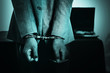 © yupachingping - Business Man's hand in handcuff, crime arrested concept