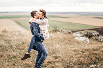 Wall Mural - Romantic pretty young couple have fun outdoor.