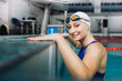 © dsheremeta - Beautiful Female Swimmer on pool edge