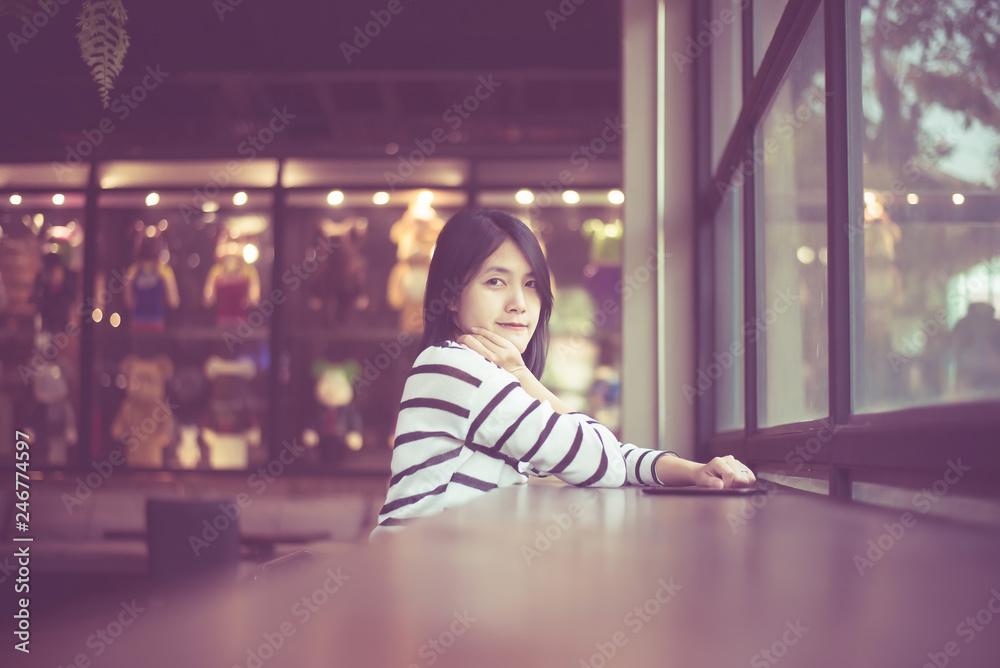 Portrait of beautiful asian woman smiling and looking camera in coffee ...