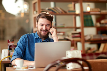 Wall Mural - Modern communication with cell phone and laptop