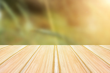 Wall Mural - Empty wooden table with blurred green background. concept party, products, spring