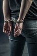 © appledesign - women handcuffed in criminal concept