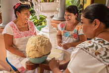 Women Making Tortillas. Group Of Smiling Cooks Preparing Flat Bread Tortillas In Yucatan, Mexico