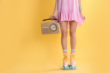 Young Woman With Roller Skates And Retro Radio On Color Background, Closeup. Space For Text