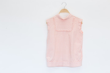 Woman blouse with pink and white sleeved plaid cotton on white background.