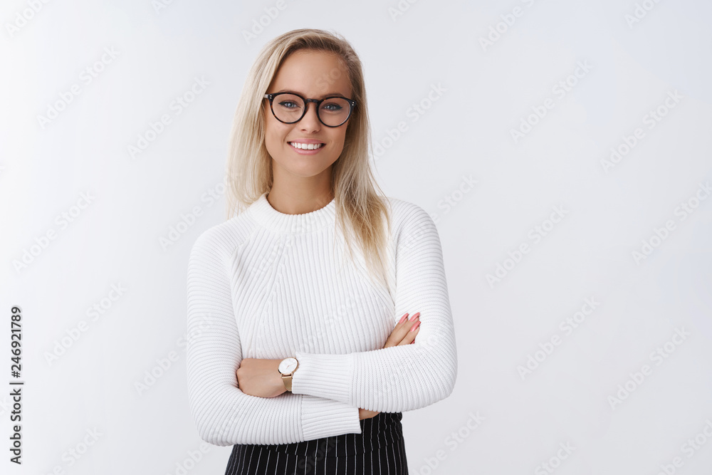 Business, entreprener and finance concept. Confident young female boss leading new project feeling determined and assured cross hands over chest and smiling accomplished over white background