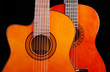 © yrafoto - Two acoustic guitars. Close-up