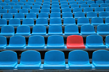 Empty seats in a stadium with one special