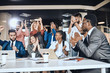 © alfa27 - cheerful business team applauding at meeting, situation of success.happines. the growth of company.