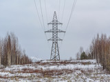 Fototapeta Na ścianę - Support line vyskokovolnoy transmission in winter with a cloudy sky