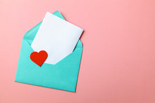 Love Letter. Message Of Declaration Of Love. Green Envelope With Hearts And Blank Letter On Pink Background. Mock-up.