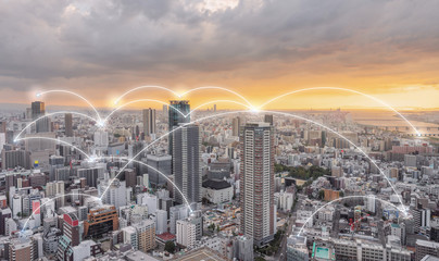 Wall Mural - Network connection technology in the city, Osaka city in sunset