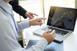 © snowing12 - Business Team trader or broker Investment Entrepreneur colleagues working discussing and analysis graph stock market trading with forex chart data, financial, selling and buying concept