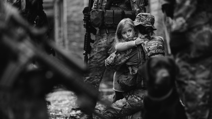 Soldier and children on battlefield background.