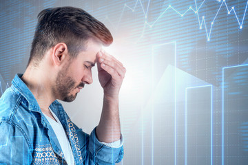 Wall Mural - Stressed businessman with headache, graph