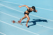 © Juan Algar - young woman training on running track
