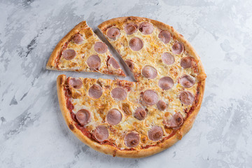 Wall Mural - Tasty pizza with sausage on white background