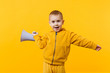 © ViDi Studio - Little fun kid boy 3-4 years old in yellow clothes holding, speaking in electronic megaphone isolated on orange wall background, children studio portrait. People childhood concept. Mock up copy space.