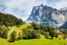 Sunny View Of Alpine Eiger Village. Location Place Swiss Alps, Grindelwald Valley.