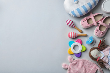 Wall Mural - flat lay composition with baby accessories and toys on gray background. space for text