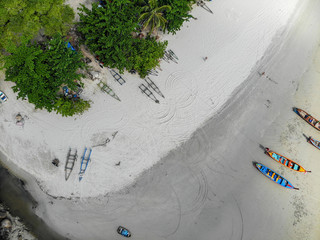 Blue sea.There are many Vietnamese Asian colored boats in the ocean near the isolated Island. the view from the top...