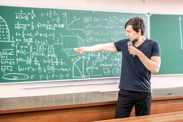 young man giving business meeting in conference hall b