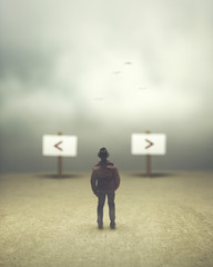 man in doubt between road signs