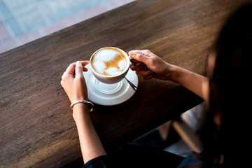 Wall Mural - Girl having coffee in the bar