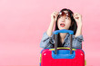 © anon - Traveler tourist woman in summer casual clothes.Asian Smiling woman wearing sun glasses.Passenger traveling abroad to travel on pink background.