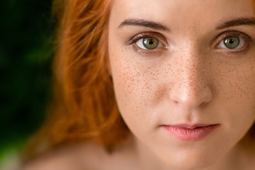 beautiful young freckled green-eyed lady with red hair