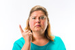 Portrait of serious woman pointing her finger upward