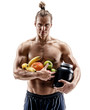 Resting time. Handsome muscular man holding fresh fruits and big jar of sports nutrition isolated on white background. Organic food and health concept
