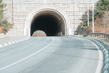 road to the mountains with a tunnel.